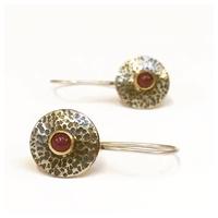 Silver and gold earrings set with rubies