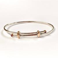 Silver and gold bangle set with garnets