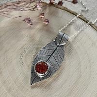 Fine silver leaf pendant with Goldstone.