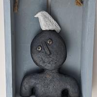 Dark man with bird in box/Volcanic black stoneware clay//20cmx28cm