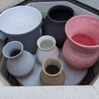 Freshly glazed vessels ready for a stoneware firing!
