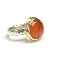 Carnelian set with gold bezel on silver ring shank
