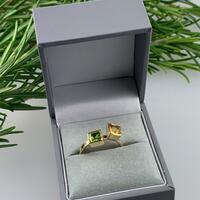 Contemporary ring set with square Peridot and Citrine in 9ct yellow gold