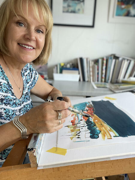 Elizabeth Baldin painting at her home studio