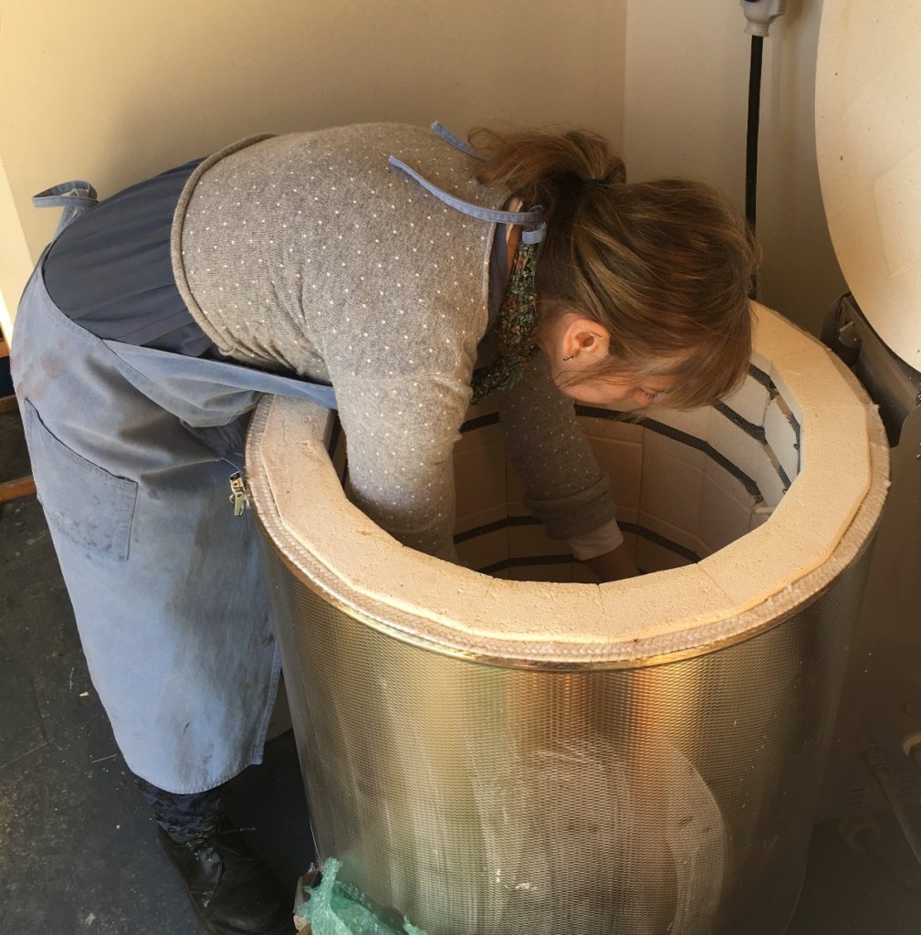 Moya Tosh unloading the kiln.