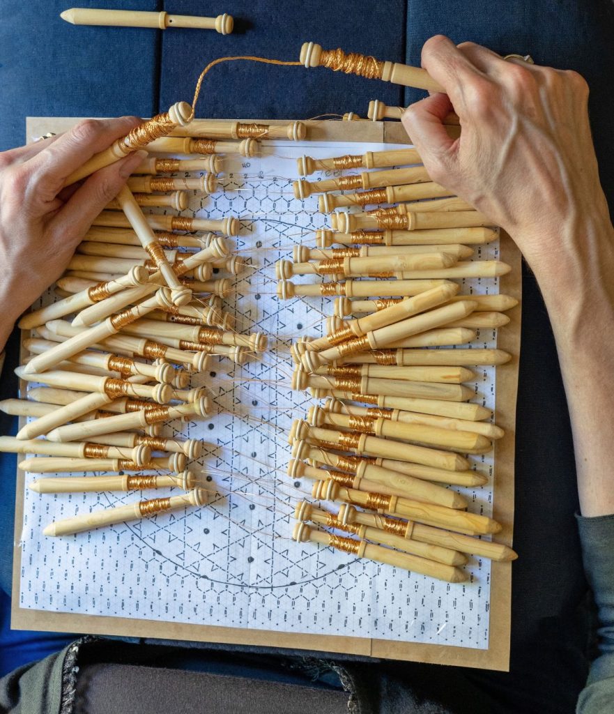 Bobbins wound with copper wire waiting to work
