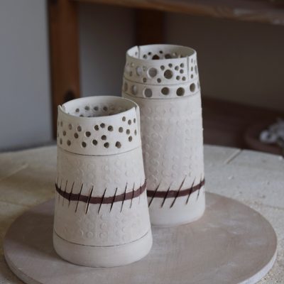 leather hard cylinders waiting for first firing.