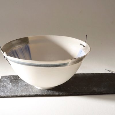 Winter bowl. Thrown porcelain with silver leaf & leather.
