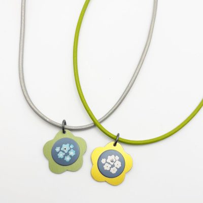Flower pendants on leather cord - anodised aluminium -8 inch